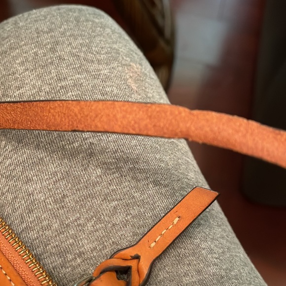 Dooney &Bourke wristlet pre owned has some flaws that are showed in pictures. - Picture 11 of 13